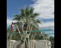 Little girl rainbow swimsuit diving board front flip belly flop