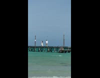 Girl white dress drone camera beach bridge