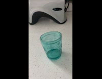 Person spin teal cup on the countertop