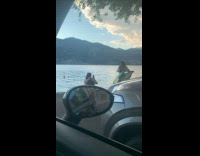 Woman dance in beach dress near ocean