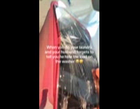 iPad with cracked screen inside laundry machine