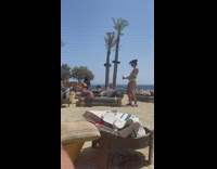 Girl in black swimsuit poses for photos