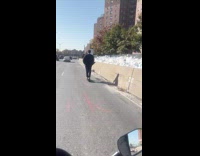 Guy no helmet rides scooter on highway