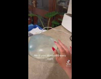 Video sped up girl runs into kitchen and slaps bubble jello on counter