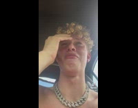 Shirtless curly hair guy crying broken tooth