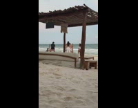 Three women in white beach outfit tiktok dance at the beach