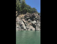 Guy cliffs dives at campground 