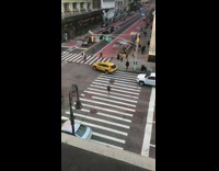 Collab WINY - Guy looks out window at person jaywalking 