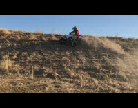 Guy turns and drifts on ATV falls off and engine breaks down slow motion