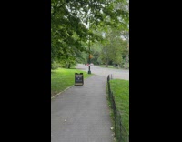 Person rides scooter through park while being chased by the police 
