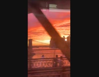Sunset view filmed from elevated train railway