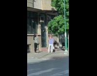 White pants girl sidewalk car blinker stroller 