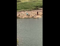 Woman red pants raise leg yoga pose