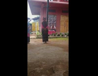 Chihuahua reacts to native woman singing 