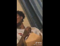 Guy eats food laughs with friend