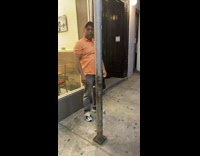 Guy walks down street on all fours