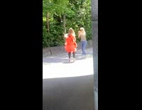 Red dress black leggings girl dances arch 