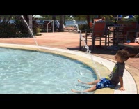 Kids pretending to pee on pool