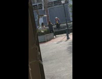 Woman sits barrier fence photo shoot