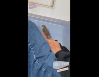 Guy asleep on subway train with a tiny bird perched on his hand 
