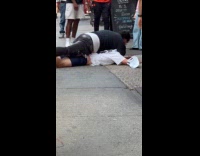 Collab WINY - Man holding down another on the ground 