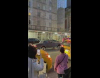 Car Tilts Sideways as it Waits on Traffic