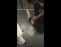 man prepares meal on subway train floor