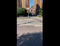 Black flip flops guy sunbathes chair sidewalk 