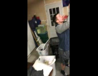 Guy accidentally pours beer behind him while drinking out of American flag beer bong