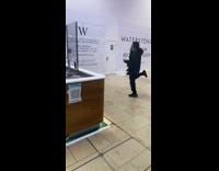 Guy black jacket dance inside mall W