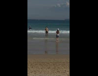 Man shirtless black shorts flex muscles beach Part 2