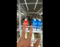 Man searching for chocolate milk at store stock room 