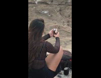 Girl takes selfie instead of sunset photo 