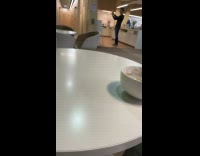 Man talks for selfie video in lounge