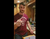 Three guys ear Carolina reaper world's hottest pepper in kitchen