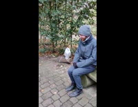 Man sit beside white owl smile together