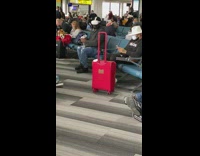 Guy uses VR headset at airport lobby 