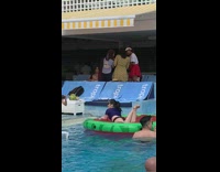 Asian woman squat blue shirt watermelon 