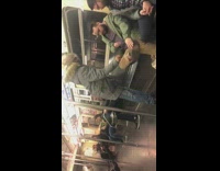 Guy drops cigarette on sitting passenger 