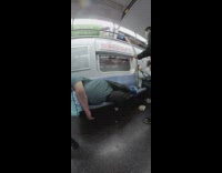 fish eye lense man in blue shirt passed out on train 