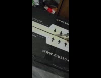 Guy opens package with cat inside box