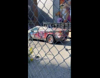 Parked Tesla Cybertruck filled with graffiti