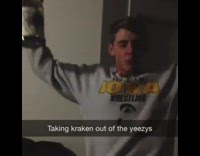 NSFW Guy property of iowa sweater drinks kraken vodka out of a black shoe