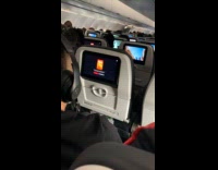 Person invite random plane passenger watch movie