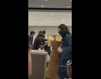 Batman signal logo on laptop batman in library