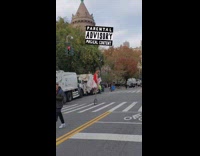 Guy in red outfit riding tall unicycle with unicorn horse seat