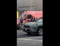 Firefighters tries opening truck using screw driver