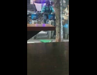 Man rides parked Citibike on the sidewalk like an exercise bike