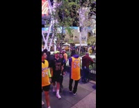 Woman taking picture Kobe memorial