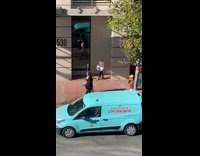 Woman white outfit photoshoot on the sidewalk